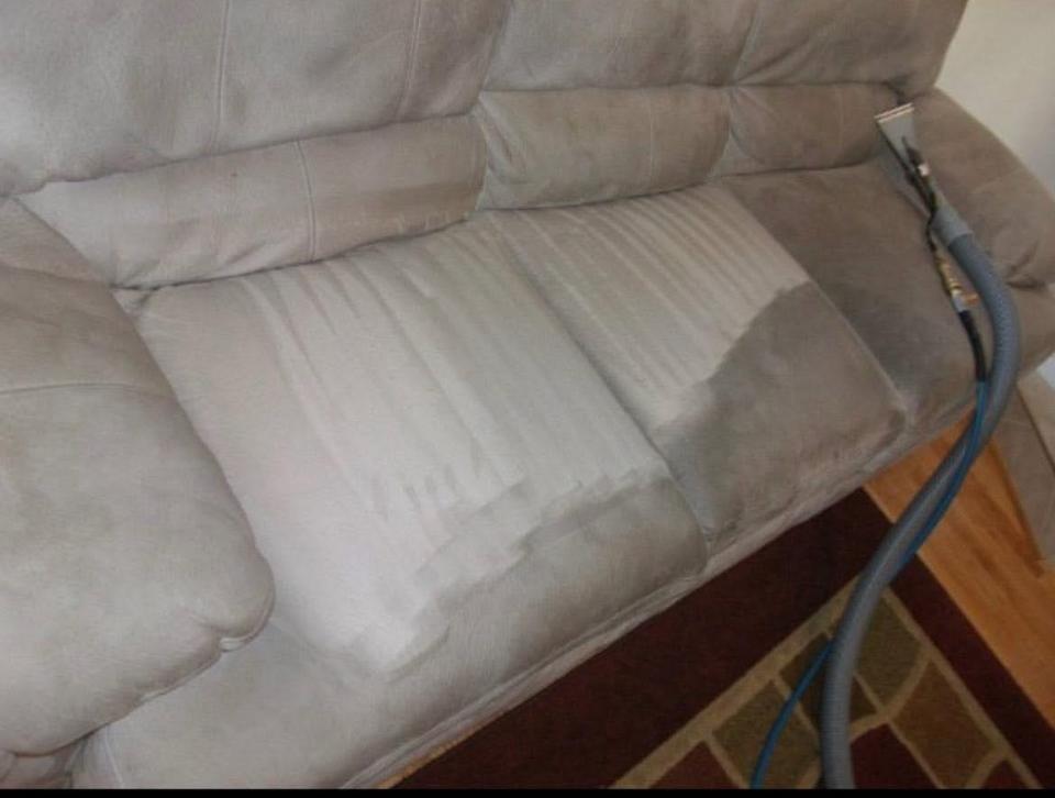 A clean sofa in a well-lit room.